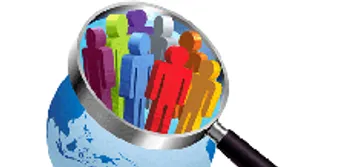 A magnifying glass over a group of stylised figures